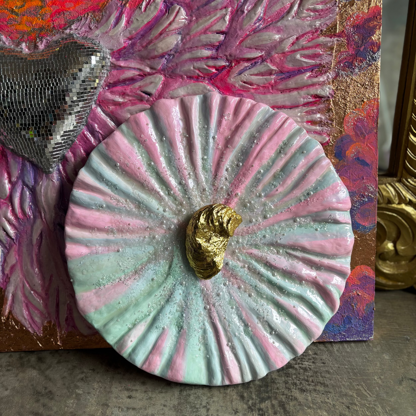 Textured Art Piece "She oyster" made in soft pink and green tones, adorned with Natural Oyster covered with Gold Leaf in the center