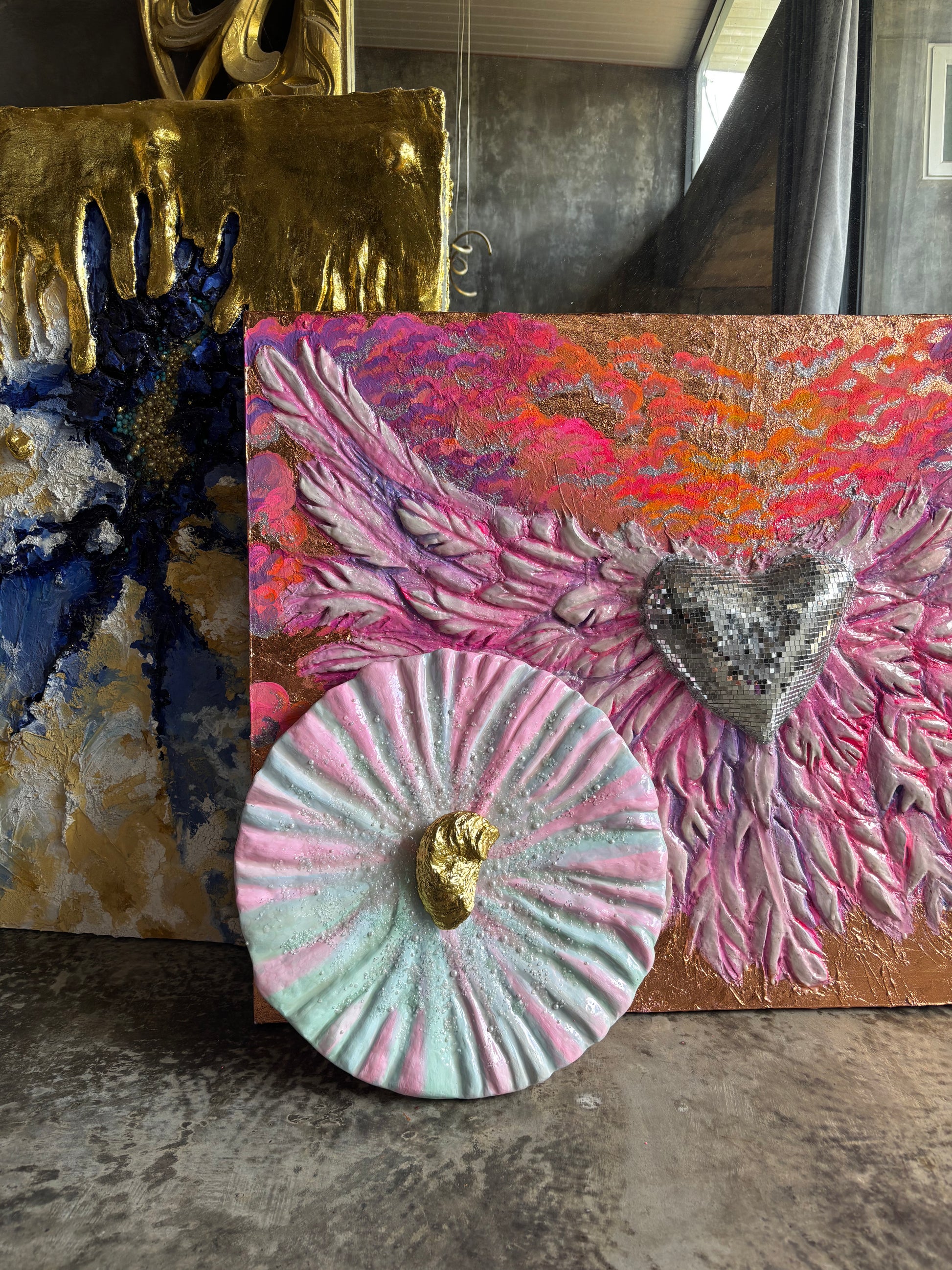 Textured Art Painting "She oyster" with golden oyster in the center on a background of the other paintings (available for sale)