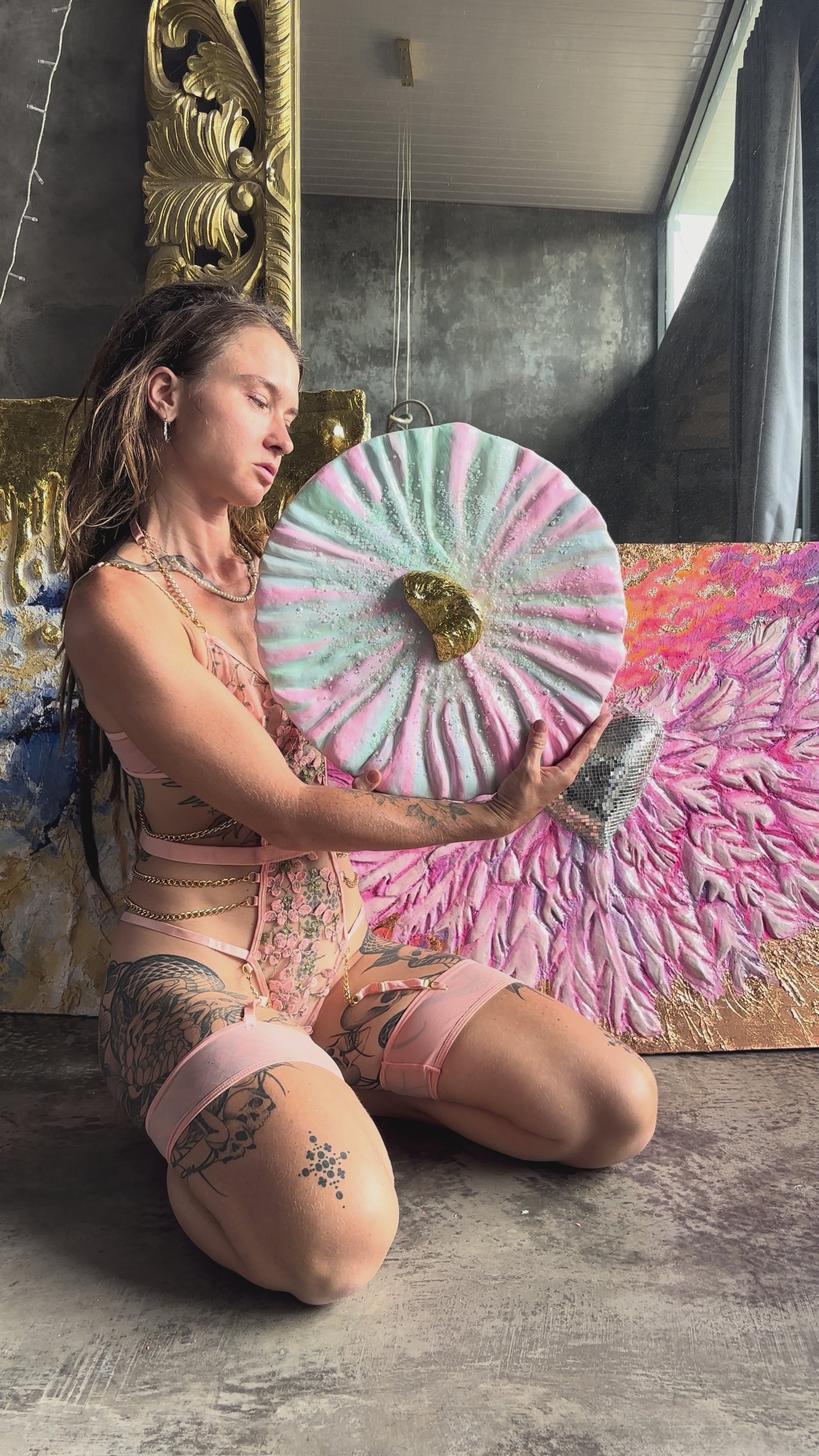 Woman holding Textured Art Painting "She oyster" with golden Oyster in the center